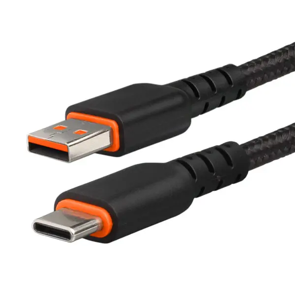 A black and orange cable is connected to the side of a wall.