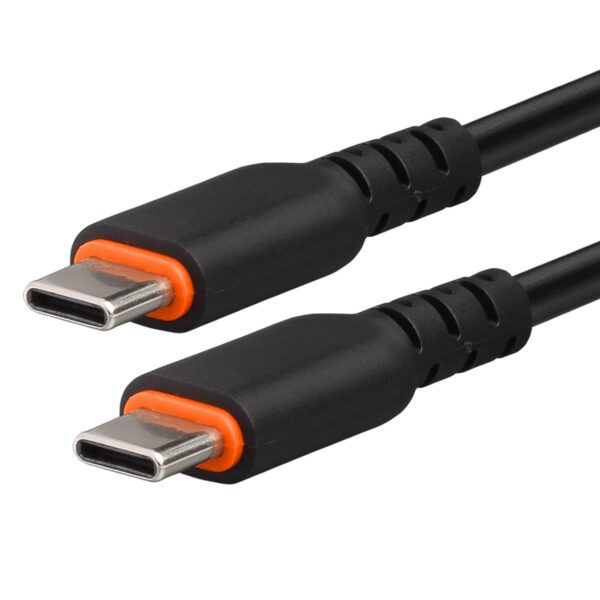 A black and orange cable is connected to the side of a white wall.